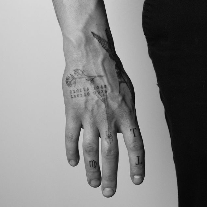 Hand with minimalist tattoos. photo in black and white